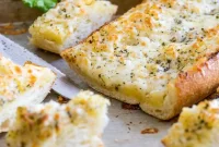 Cheesy Garlic Bread Recipe with Melted Mozzarella and Herbs