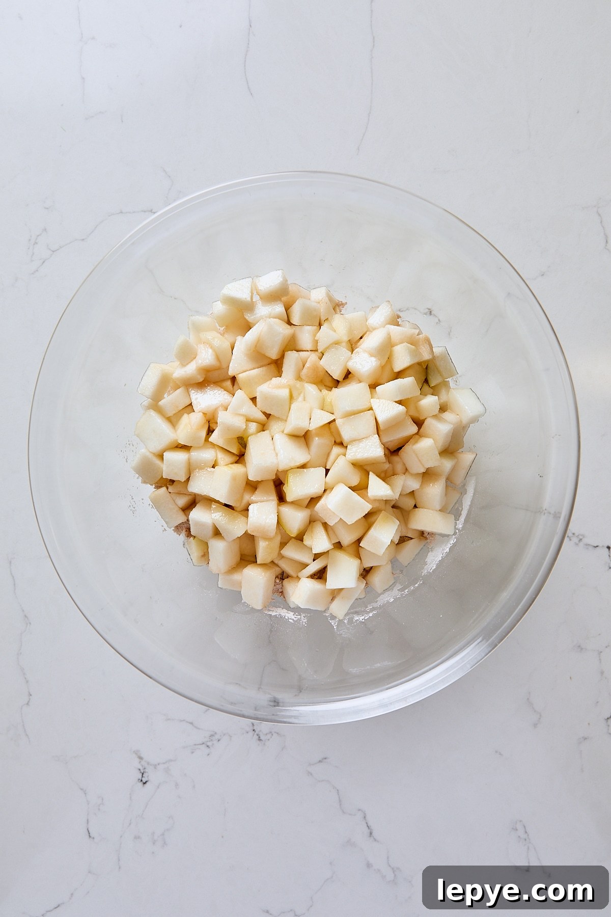 Diced pears and lemon juice added to sugar mixture