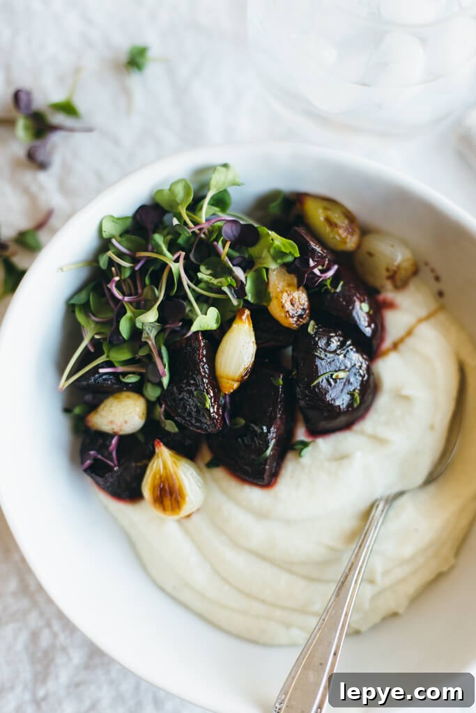 Celery root puree with balsamic roasted beets and pearl onions. A delicious veggie powered meal.