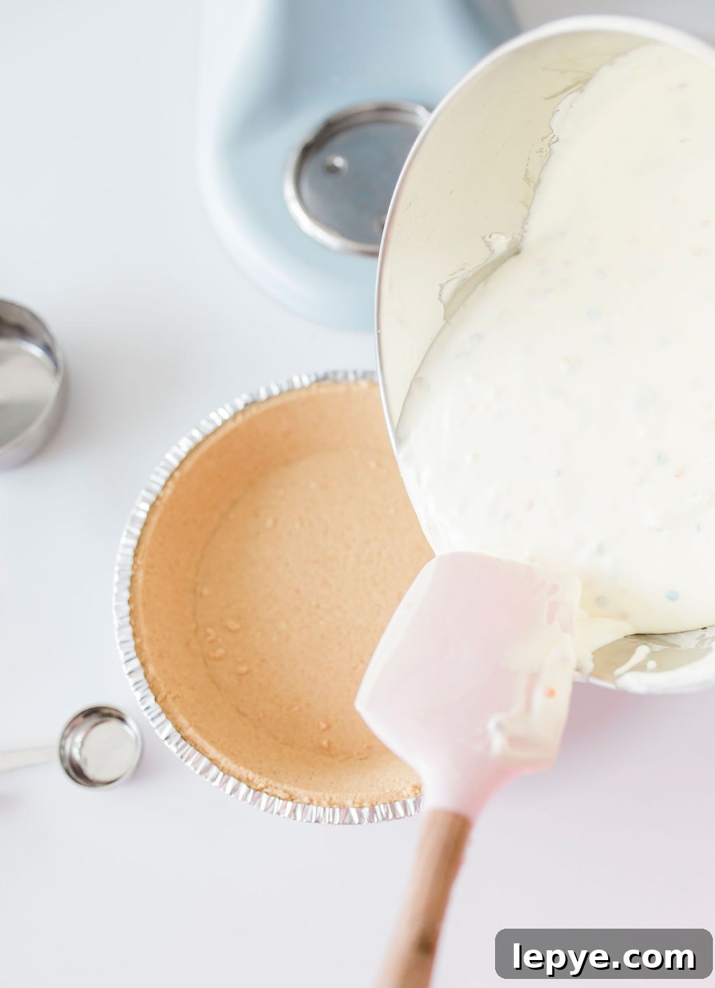 Confetti Birthday Cheesecake Recipe: Moist, Creamy & Festive 8 pouring batter