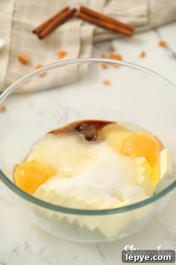 Chewy Toffee Doodle Cookie Recipe for Perfect Crunch and Flavor 3 A glass mixing bowl with sugar, butter, shortening, eggs, and vanilla for making Toffee Doodle Cookies. -Skip To My Lou