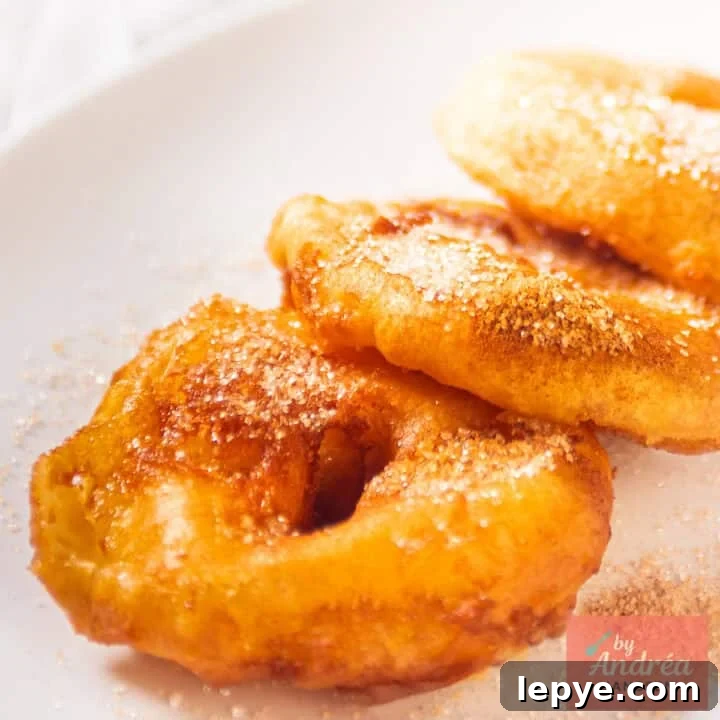 A square pircture with appel beignets (apple beignets)