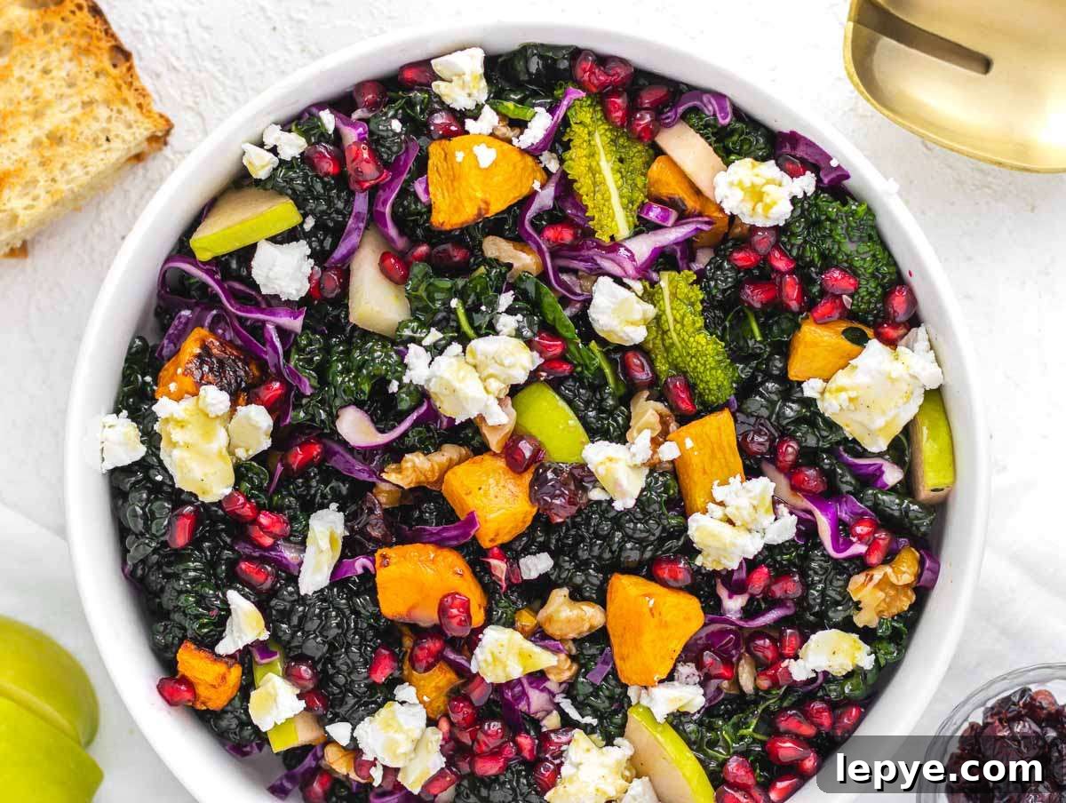 Roasted Butternut Squash and Kale Salad with Quinoa and Cranberries 8 Step 4 Colorful salad bowl with kale roasted squash apple walnuts feta and pomegranate tossed with dressing.