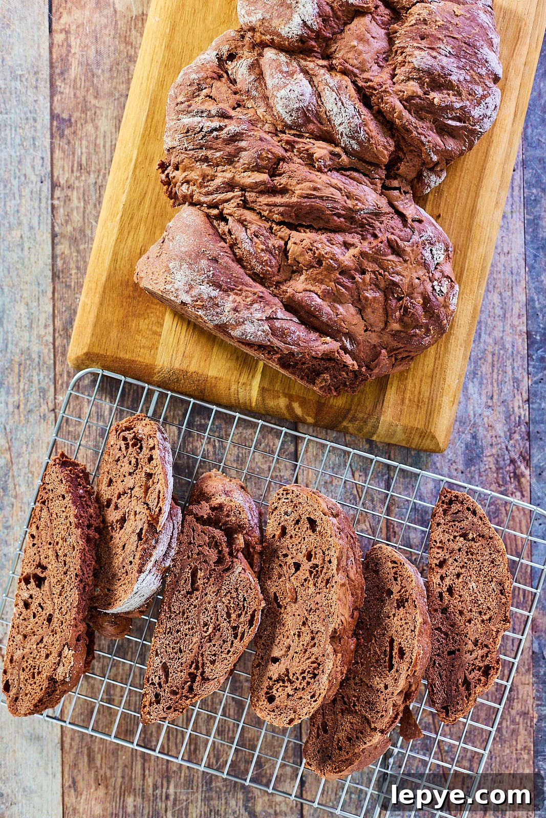 Classic Chocolate Babka Recipe: Swirled Yeast Bread Tutorial 11 Top down view of a loaf of chocolate babka sliced on a cooling rack - Hostess At Heart