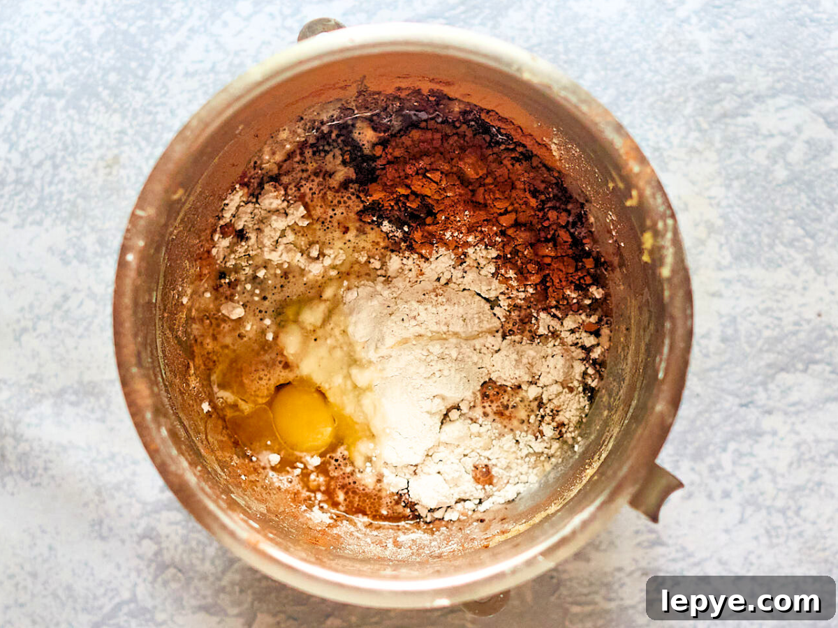 Classic Chocolate Babka Recipe: Swirled Yeast Bread Tutorial 5 A mixing bowl filled with bread ingredients before mixing - Hostess At Heart