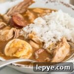 Close up of a bowl of leftover turkey with andouille and rice.