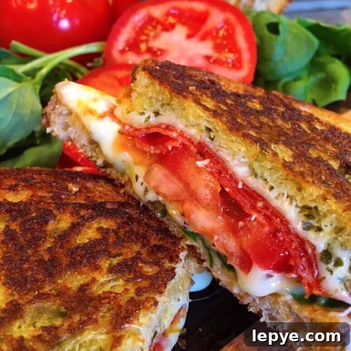 Thick Slices of golden toasted Rosemary Garlic Bread with Pepperoni, cheese, and Tomatoes