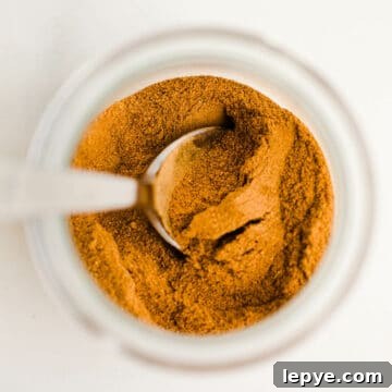 Homemade Pumpkin Pie Spice Blend for Baking and Drinks 11 Spices in a glass jar.