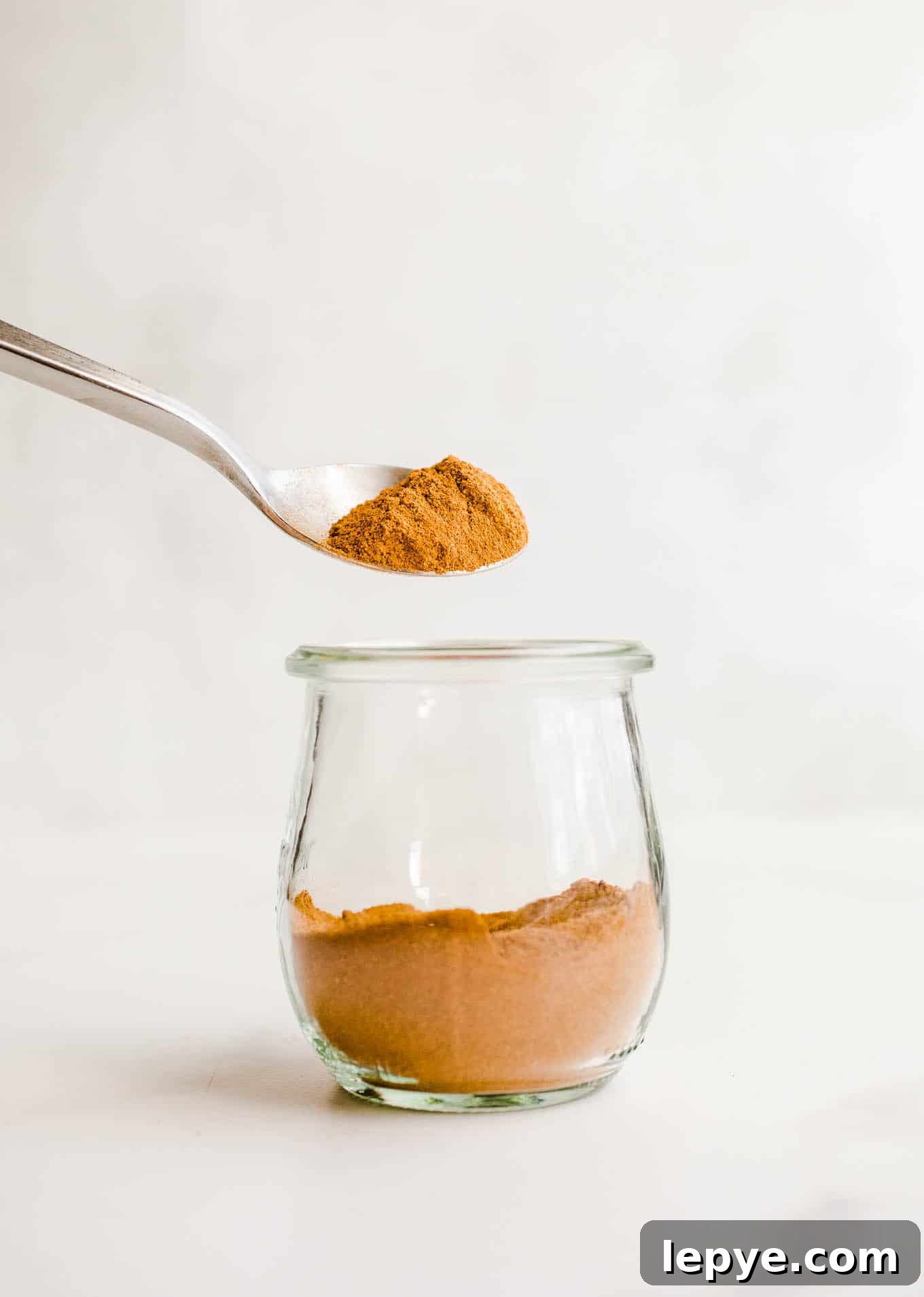 Homemade Pumpkin Pie Spice Blend for Baking and Drinks 5 A spoonful of spices.