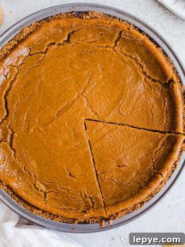 A baked pie with a sliced wedge.