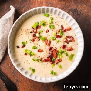 Crockpot Potato Soup with Evaporated Milk — Creamy Dinner Recipe 13 Potato soup made with evaporated milk topped with fried ham pieces.