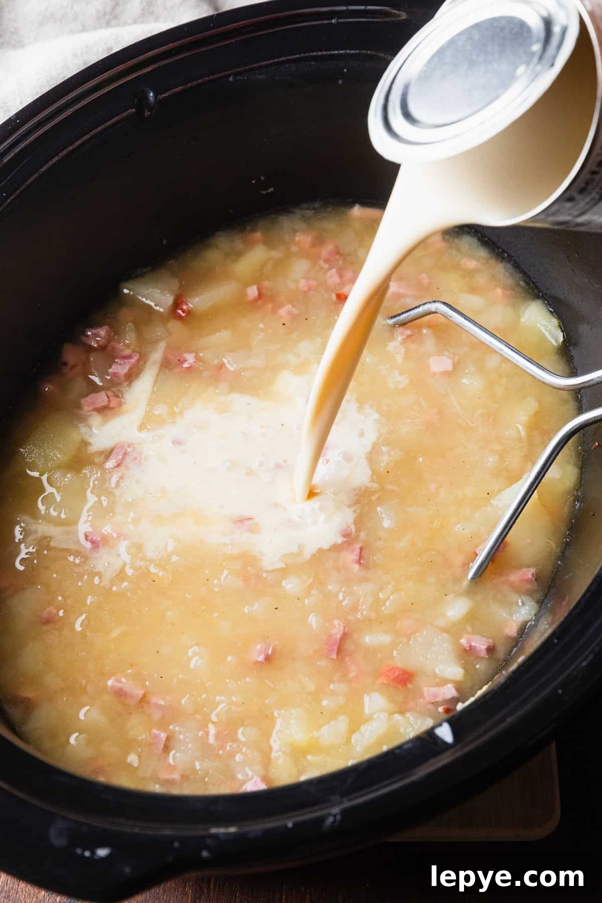 Crockpot Potato Soup with Evaporated Milk — Creamy Dinner Recipe 7 Add evaporated milk to crockpot.