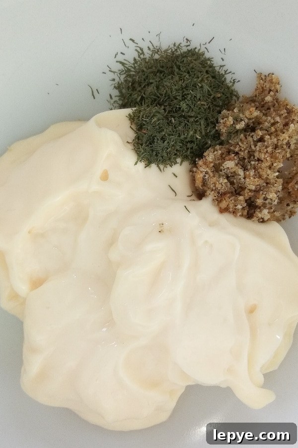 Mix mayonnaise, dill, and lemon pepper to create a creamy coleslaw dressing homemade coleslaw dressing