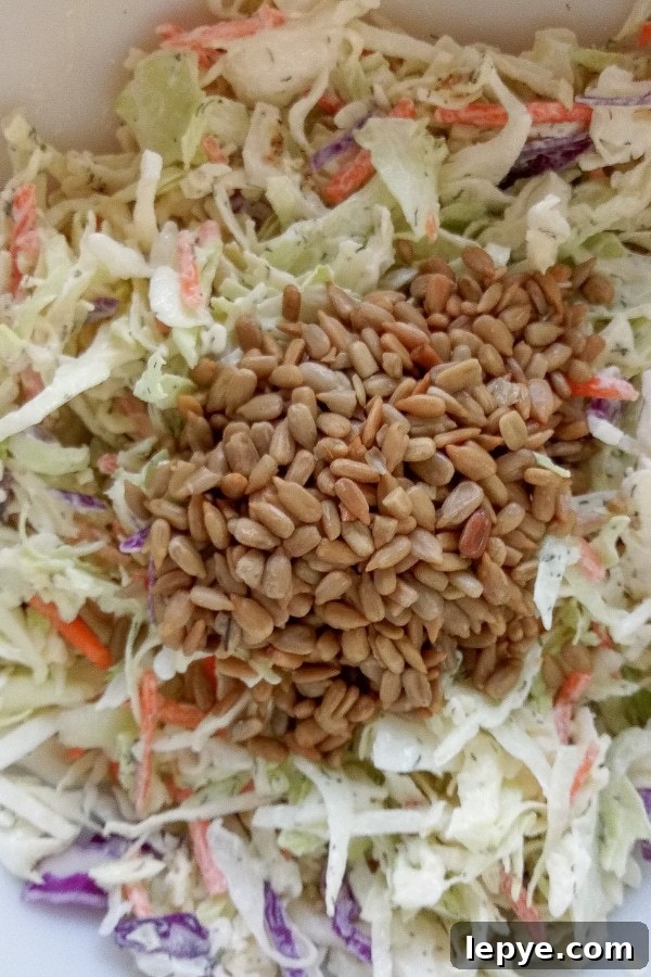 Toss coleslaw mix with dressing and sunflower seeds dill coleslaw