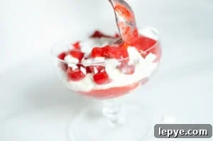 Strawberry Sauce spooned on Eton mess Dessert