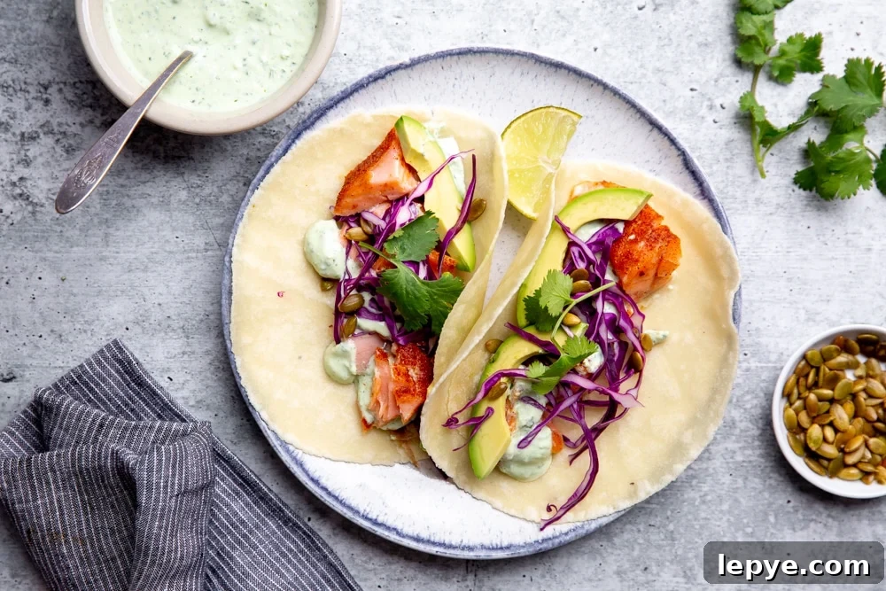 Salmon tacos with a bowl of the cilantro yogurt sauce alongside. 