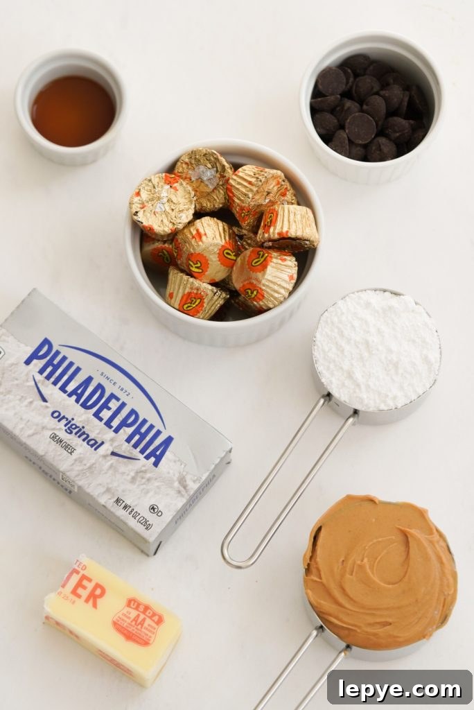 peanut butter cream cheese dip ingredients measured out on a white surface