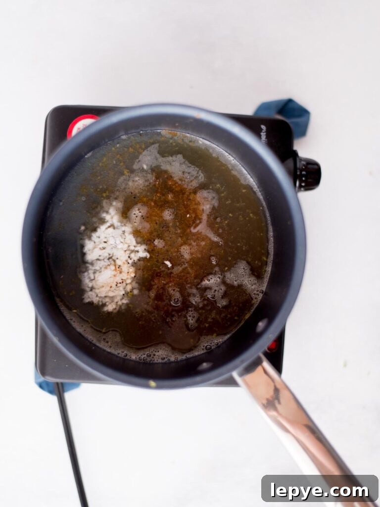 Citrus Tequila-Lime Chicken Wings Recipe for Game Day 7 Tequila lime sauce ingredients measured and added to a saucepan.