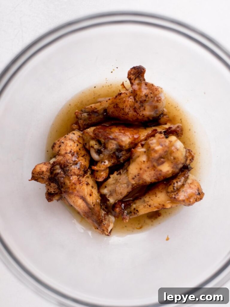 Citrus Tequila-Lime Chicken Wings Recipe for Game Day 9 Baked chicken wings in a bowl with a tequila glaze.