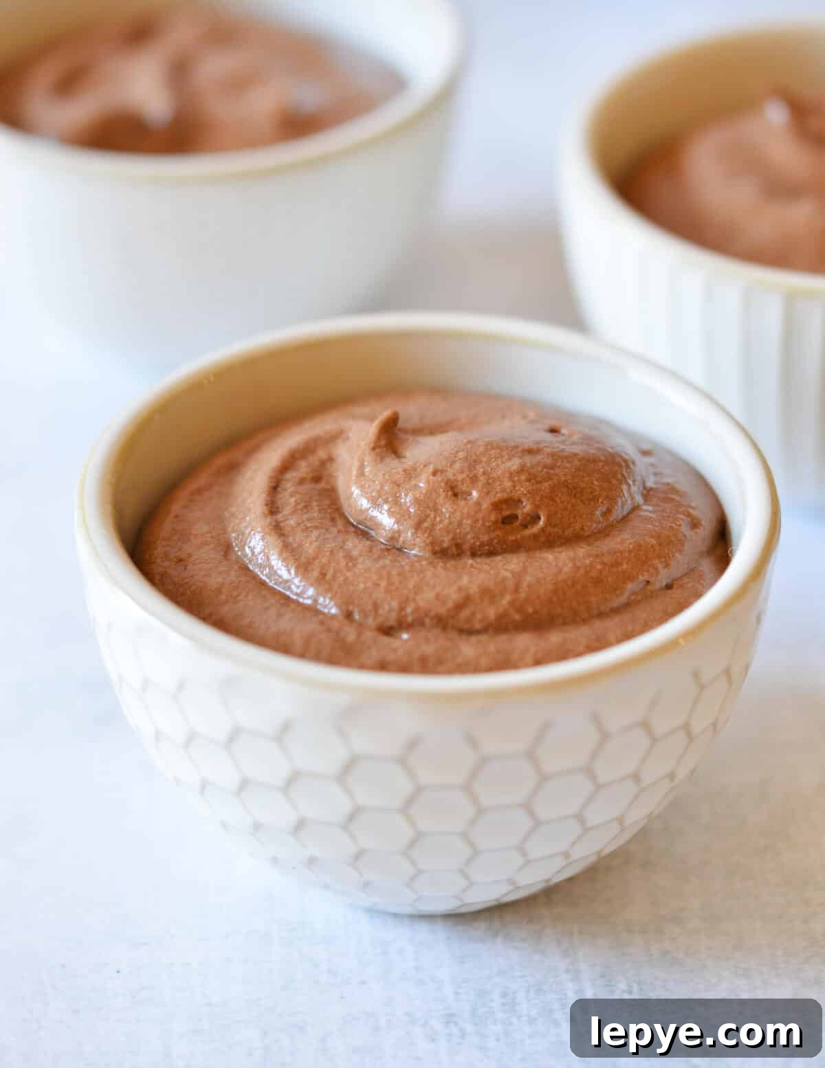 Decadent Chocolate Mousse Recipe for Silky, No-Bake Perfection 19 a small bowl of chocolate mousse.