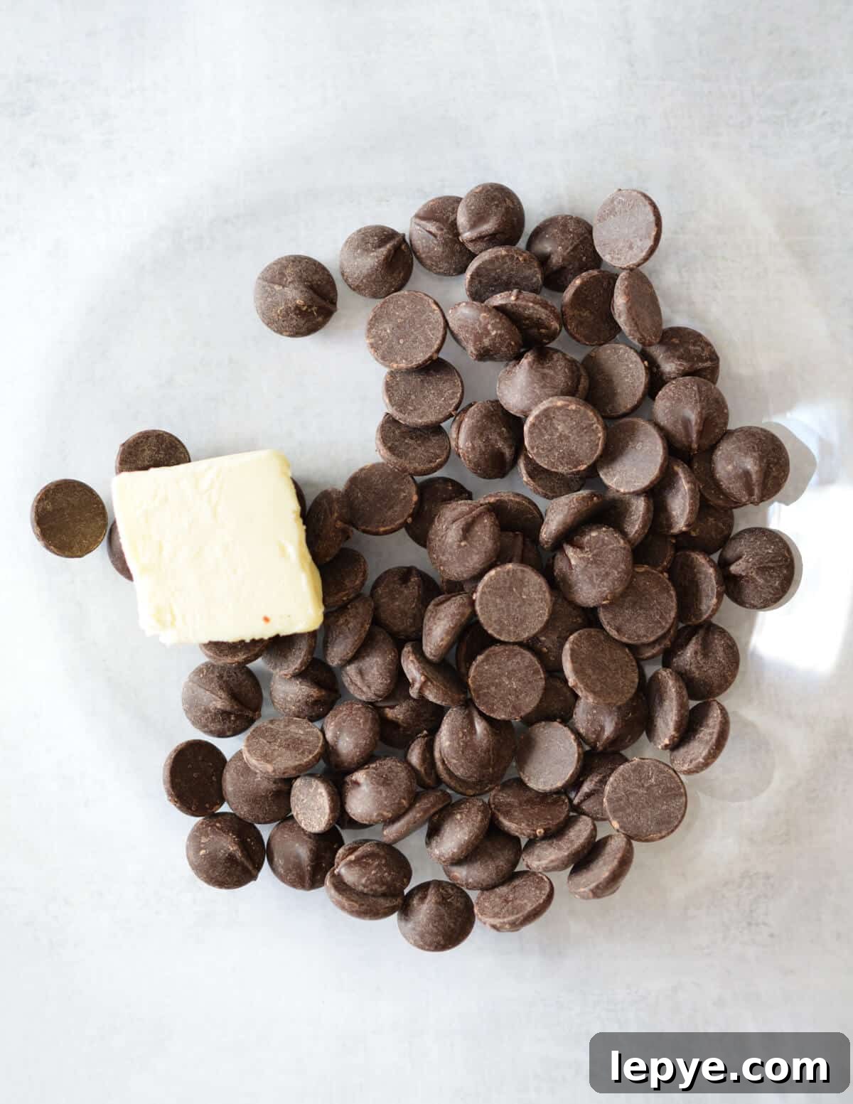 Decadent Chocolate Mousse Recipe for Silky, No-Bake Perfection 6 a bowl of chocolate chips and butter.