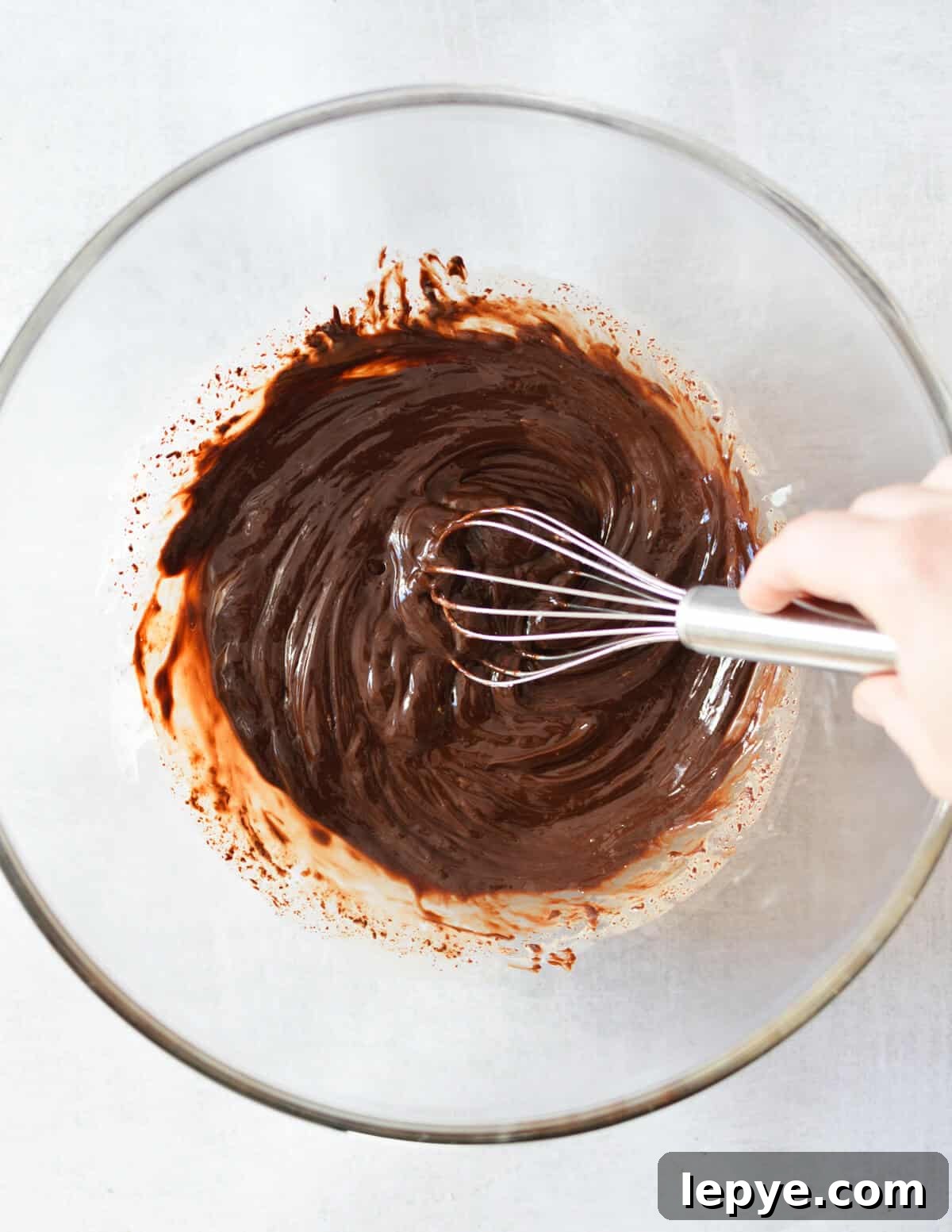 Decadent Chocolate Mousse Recipe for Silky, No-Bake Perfection 10 a bowl of melted chocolate