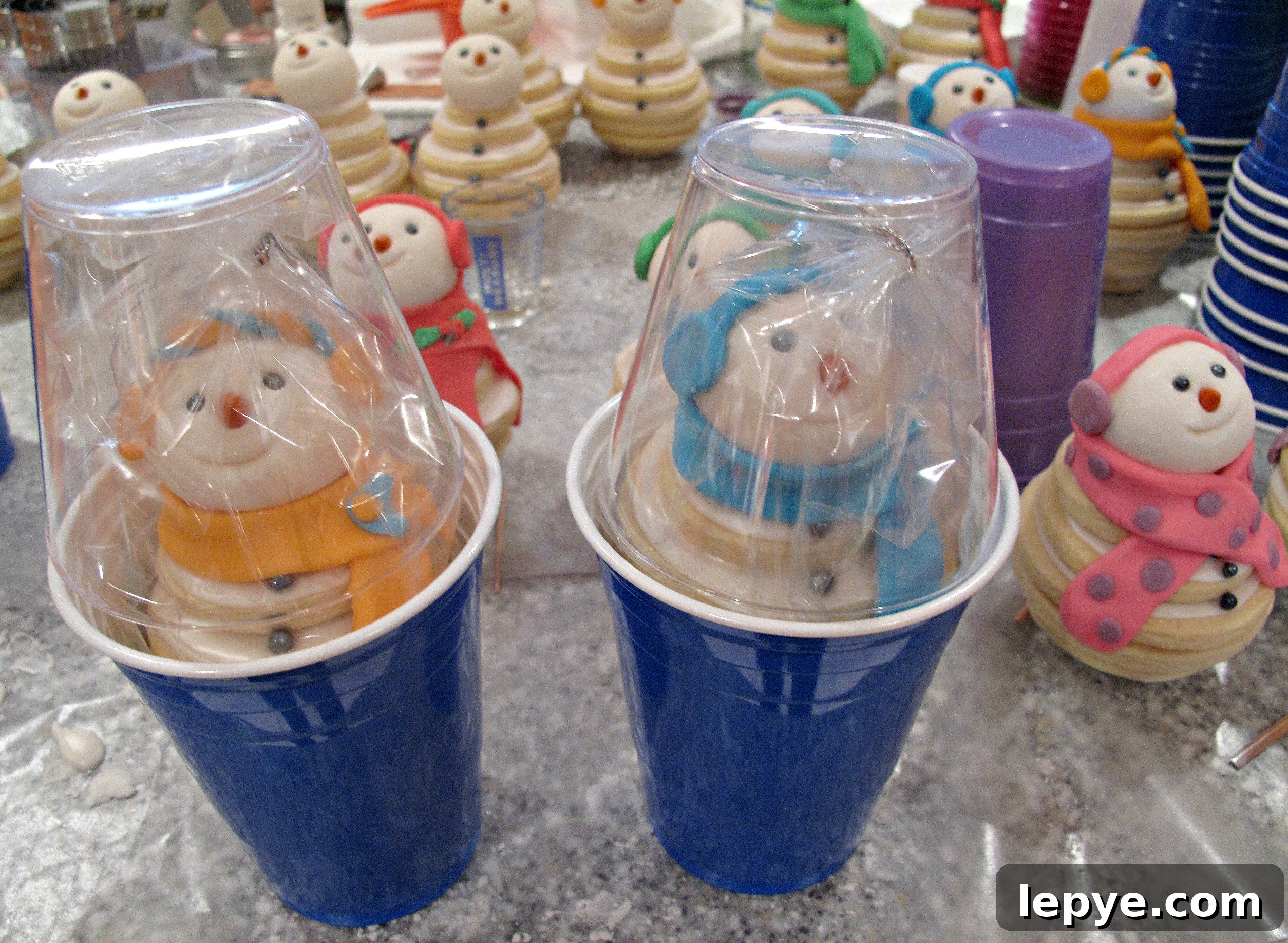  Snowmen Cookie Stacks packed in capsules made from two plastic drinking cups.