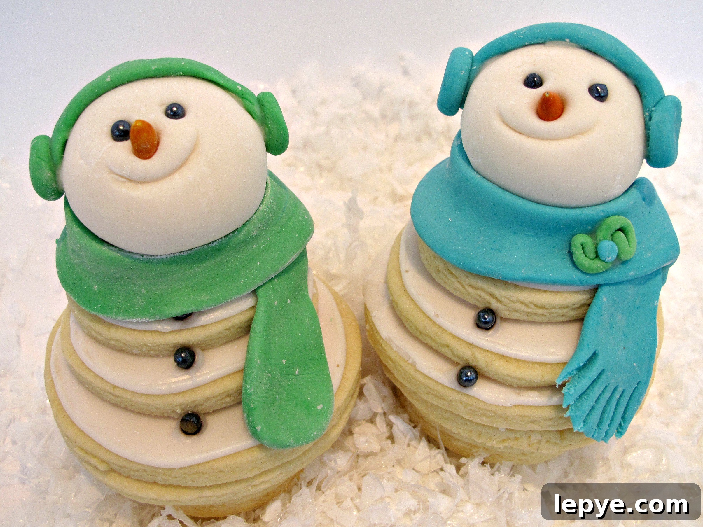 Cookie stacks decorated with fondant details.