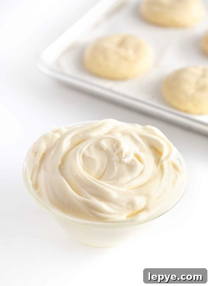 Cream Cheese Frosting Recipe for Cookies: Smooth & Spreadable 3 Bowl of white cream cheese frosting for sugar cookies