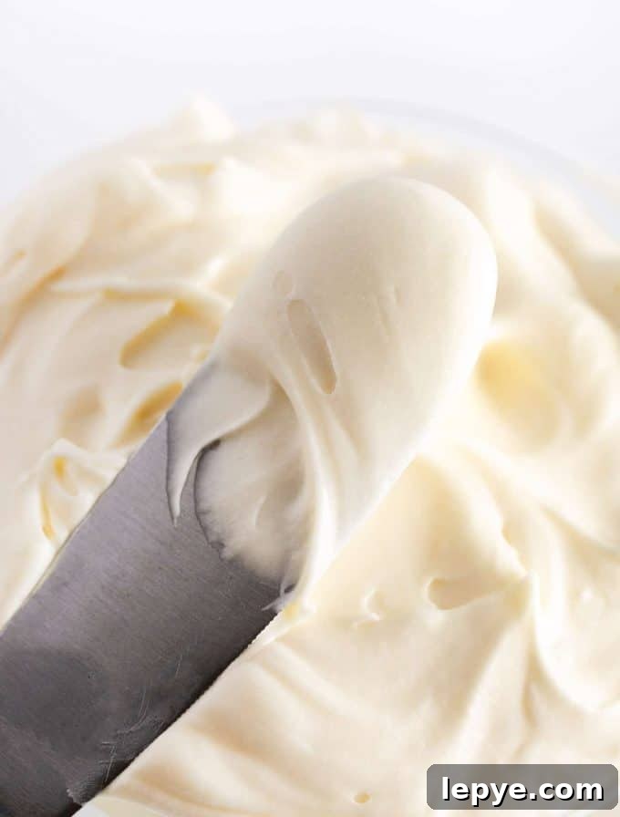 Cream Cheese Frosting Recipe for Cookies: Smooth & Spreadable 6 Spatula of vanilla cream cheese frosting for cookies