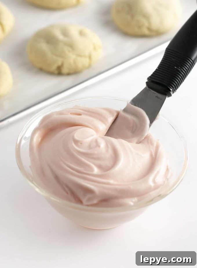 Cream Cheese Frosting Recipe for Cookies: Smooth & Spreadable 8 Bowl of pink cream cheese frosting for cookies