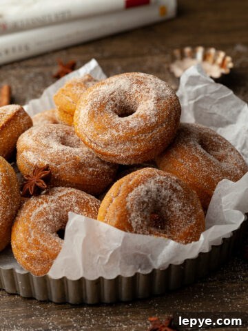 A stack of healthy gluten free baked pumpkin donuts