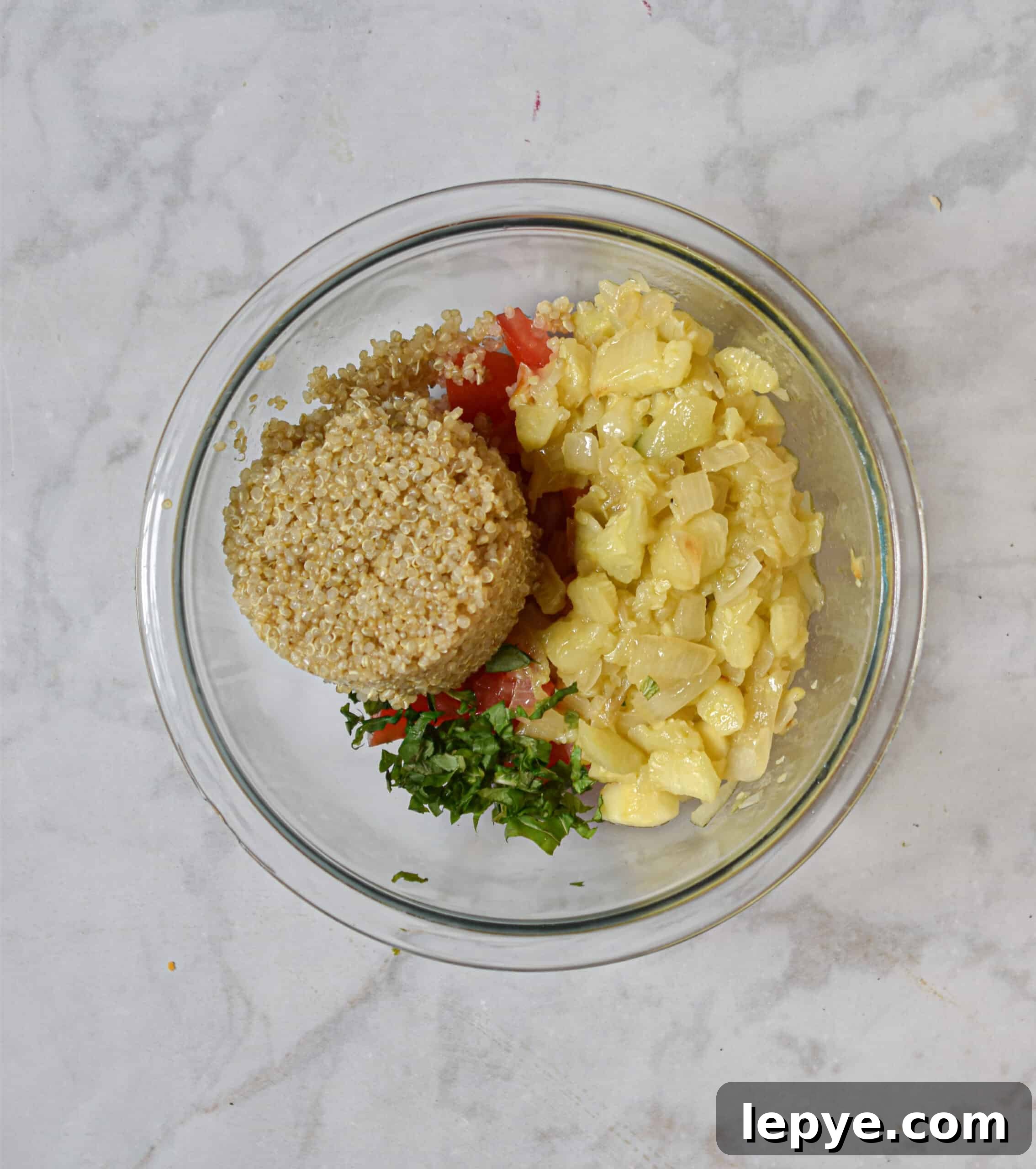 mix the quinoa, tomatoes, basil, and sautéed onions and zucchini together