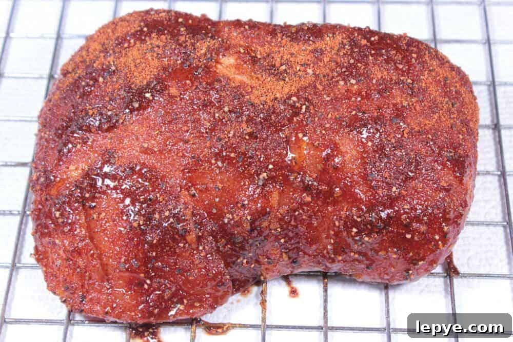 Smoked Teriyaki Pork Sirloin: Juicy BBQ Recipe for the Smoker 6 Applying rub to pork