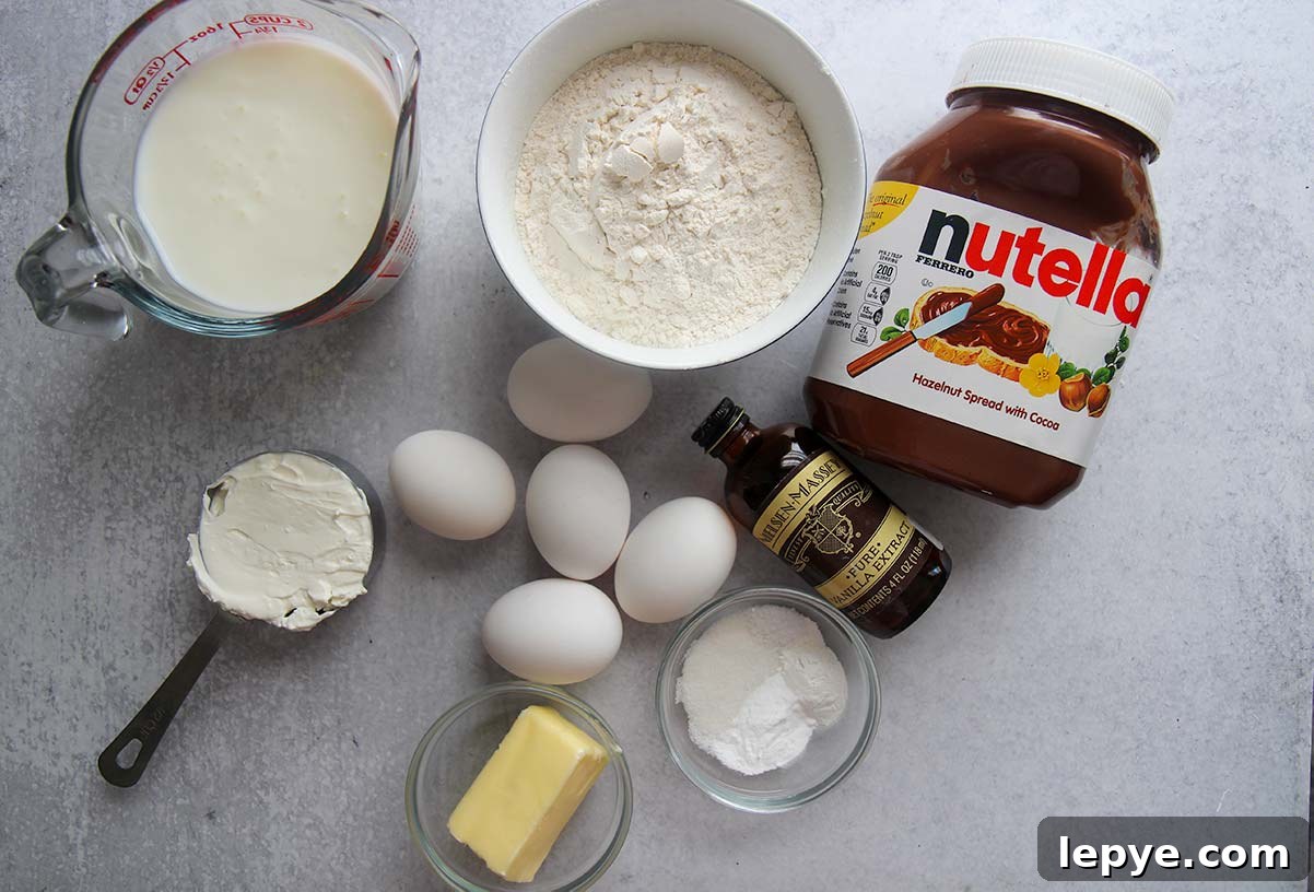 Ingredients to make Nutella stuffed Danish pancakes. Eggs, buttermilk, butter, Nutella, flour, sour cream, and vanilla extract.