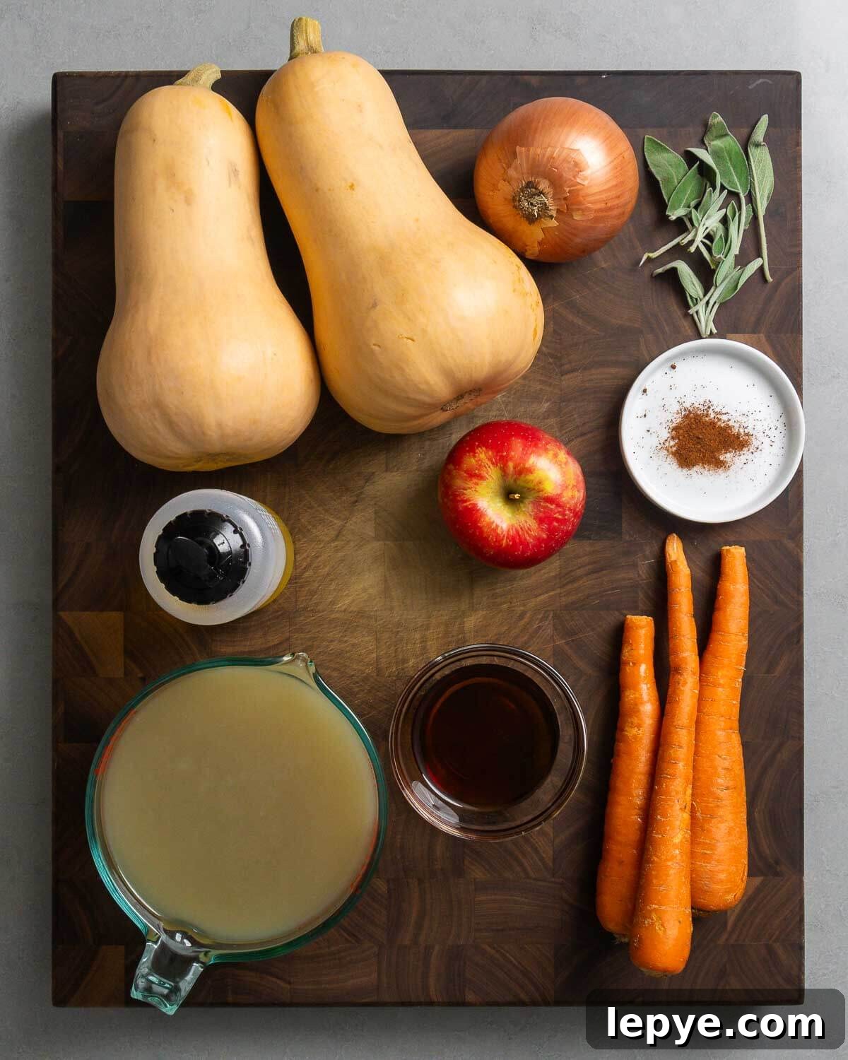 Ingredients shown: butternut squash, onion, sage, olive oil, apple, nutmeg, vegetable stock, maple syrup, and carrots.