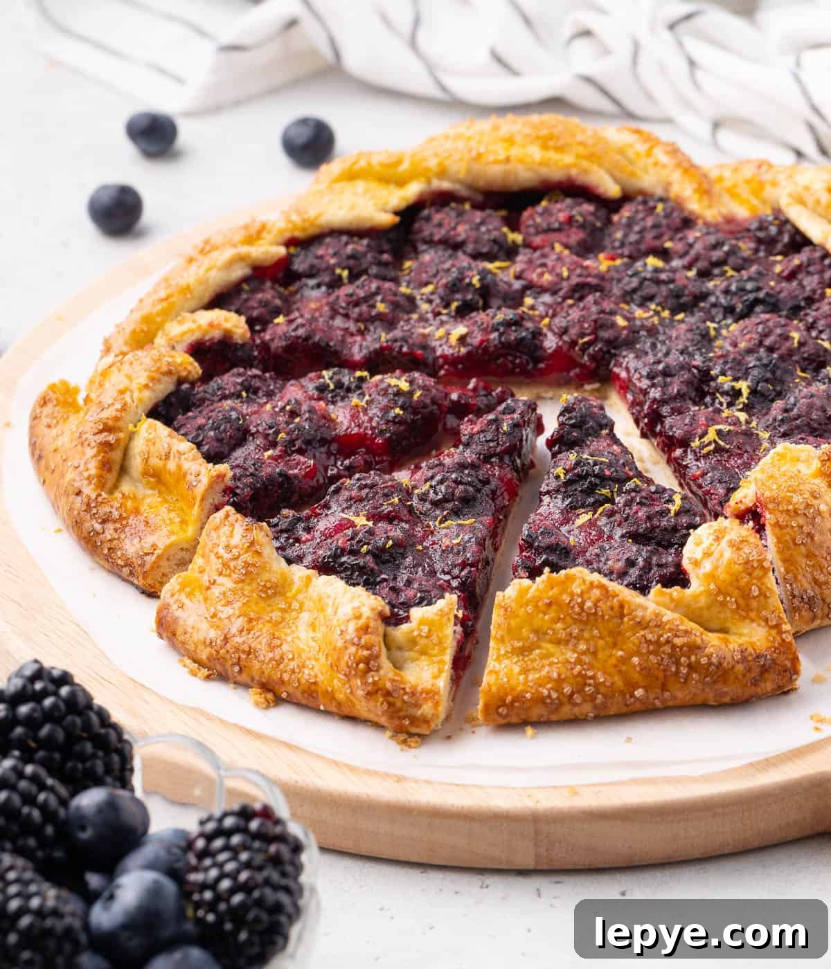 Side view of the galette with 3 slices cut out.