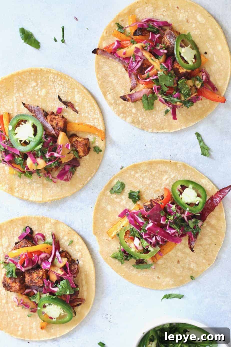 Zesty Tofu Tacos with Peach and Cabbage Slaw 3 Change the tofu game with these delicious Zesty Sheet Pan Tofu Tacos with Peach Kale Slaw! A fresh, flavorful, wholesome meal the entire family will devour. Vegan + gluten-free.
