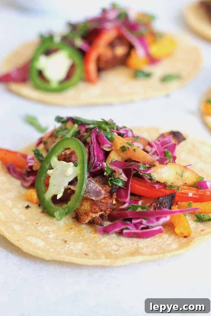 Zesty Tofu Tacos with Peach and Cabbage Slaw 6 Change the tofu game with these delicious Zesty Sheet Pan Tofu Tacos with Peach Kale Slaw! A fresh, flavorful, wholesome meal the entire family will devour. Vegan + gluten-free.