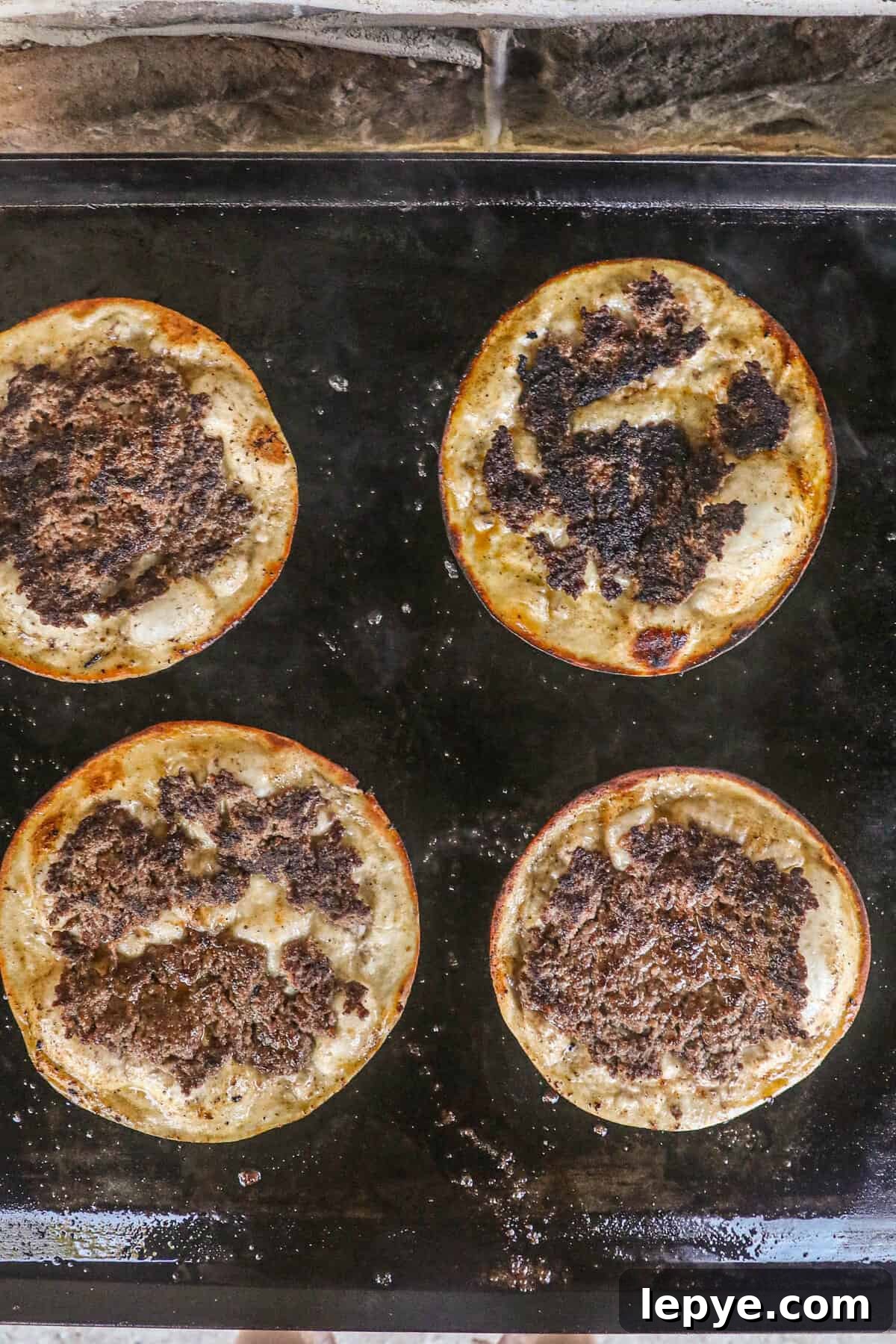 Flipped open faced Smash Burger Tacos on Blackstone griddle