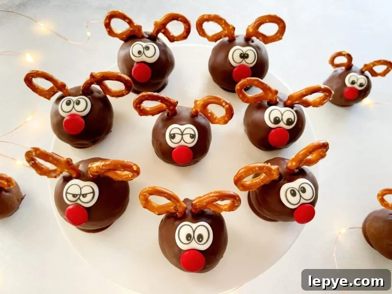 reindeer cake pops on a cake stand.