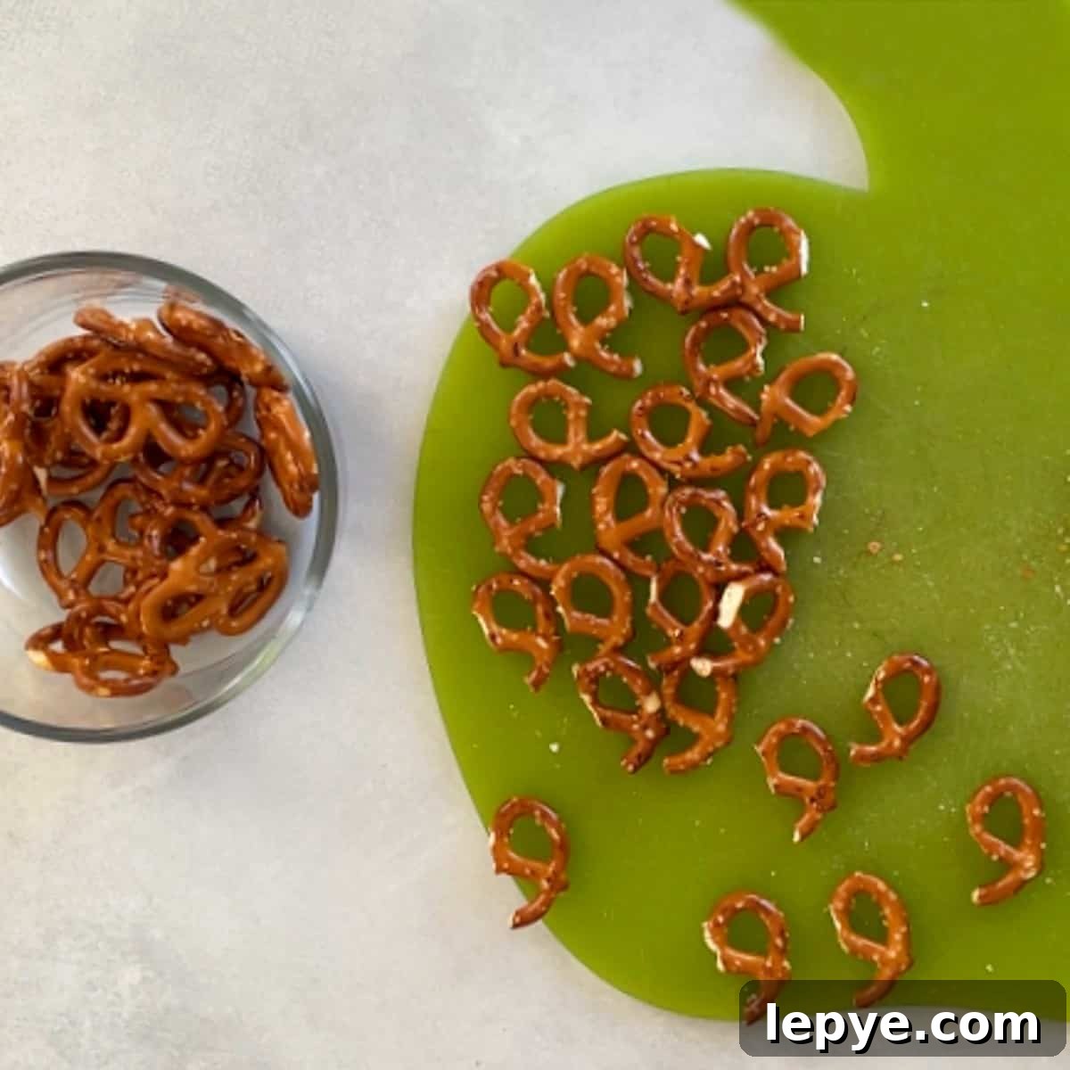 pretzels cut in half on a cutting board.