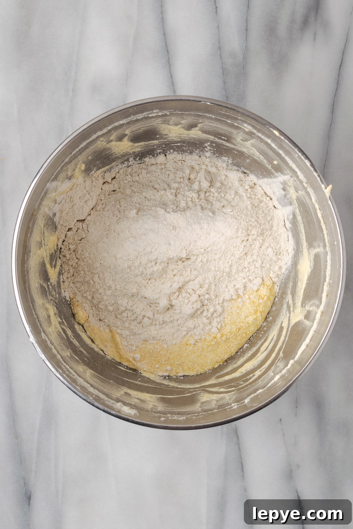 Dry ingredients being mixed into the wet ingredients.