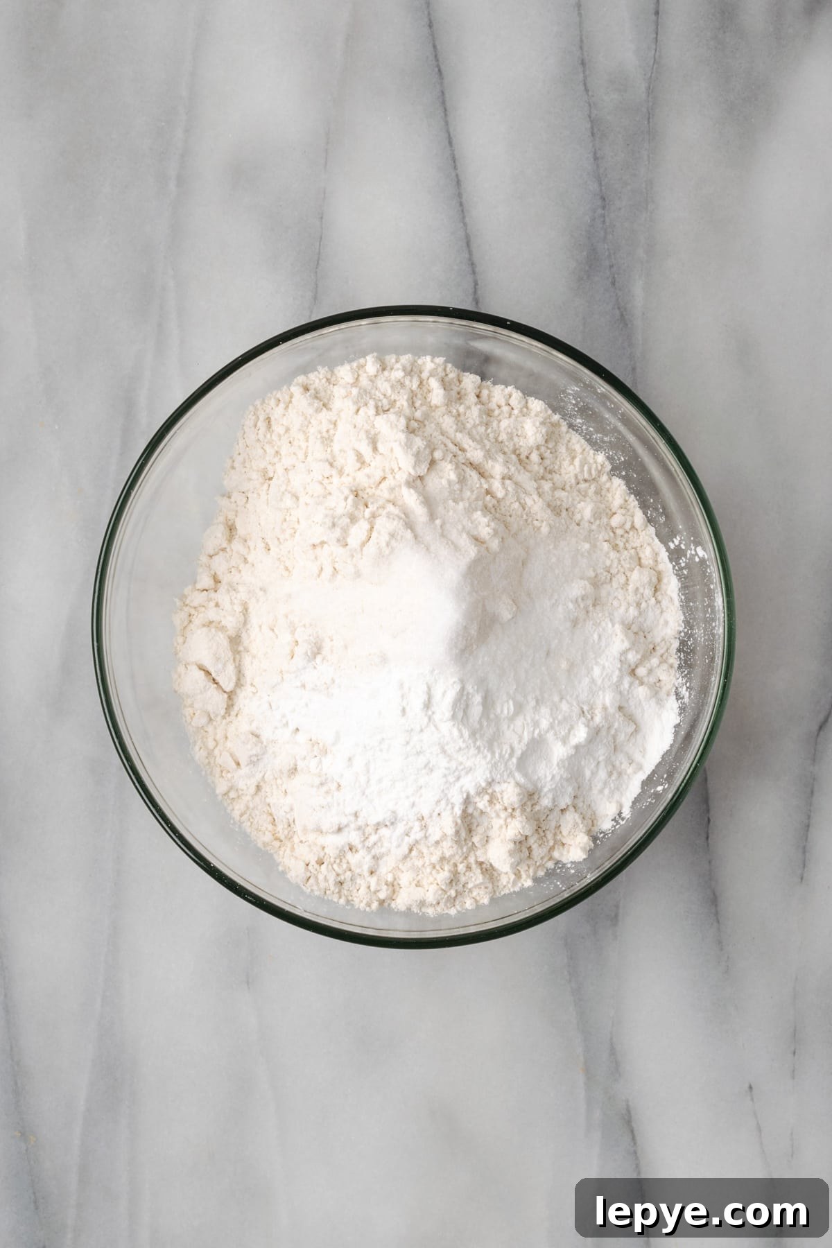Gluten free flour, baking powder and salt combined in a small bowl.