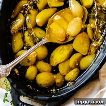 garlic in olive oil in baking dish.