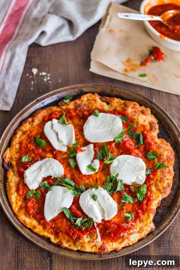 A pizza sitting on top of a wooden table