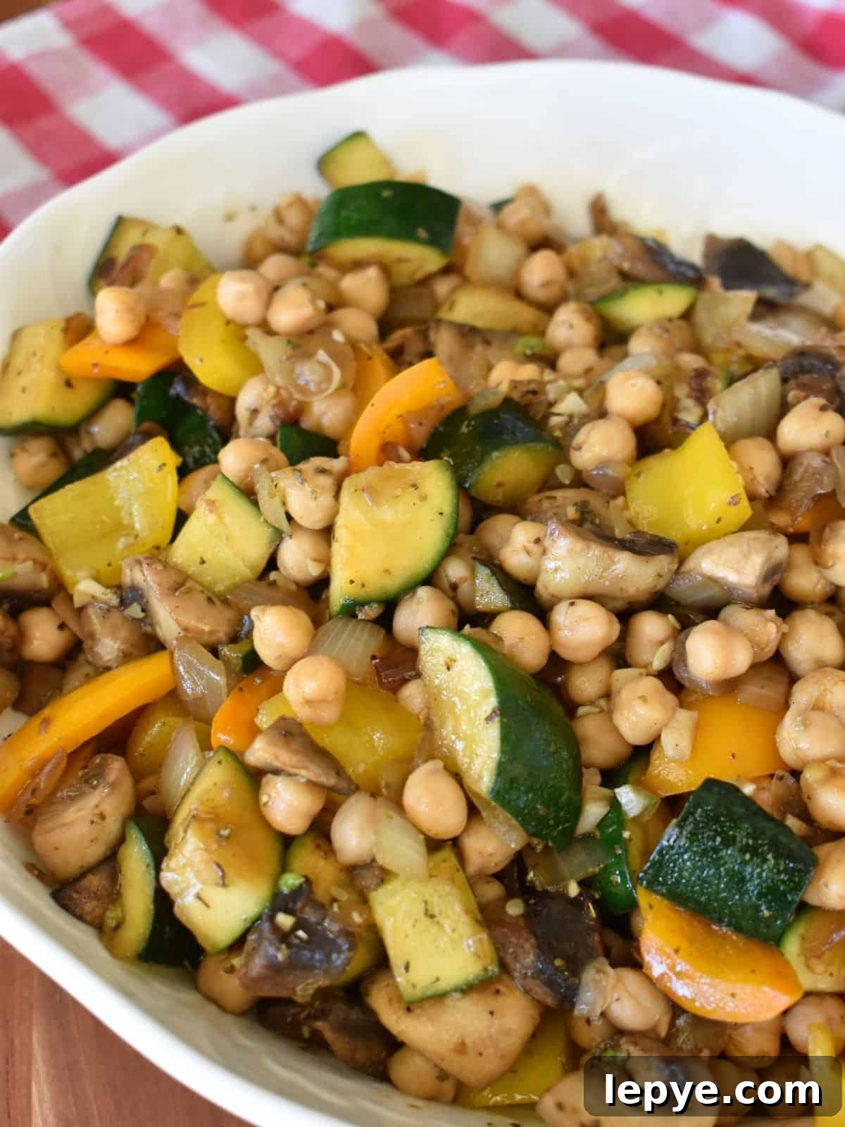 Stovetop Pan-Roasted Vegetables with Garlic White Beans 2 Pan Roasted Vegetables and Beans in a white serving bowl.