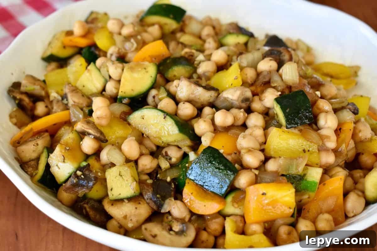 Stovetop Pan-Roasted Vegetables with Garlic White Beans 3 Pan Roasted Vegetables and Beans in a white serving bowl.