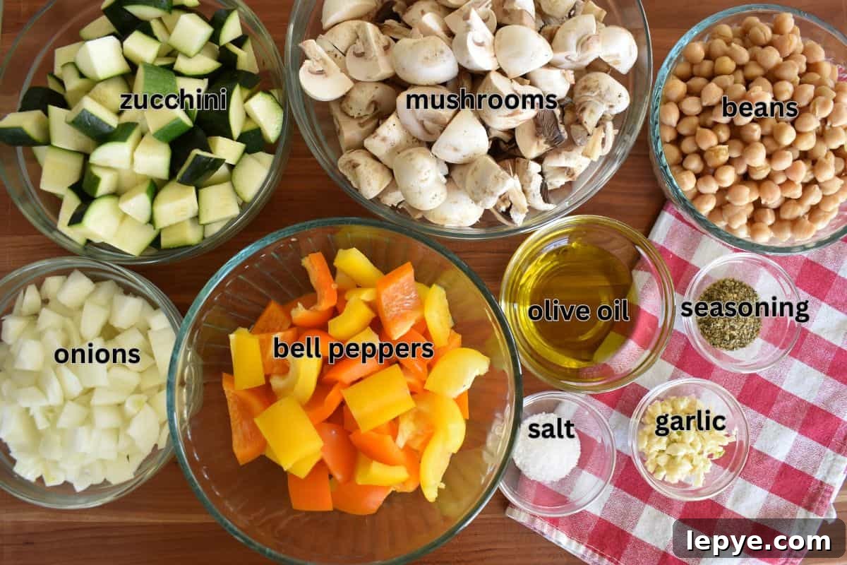 Stovetop Pan-Roasted Vegetables with Garlic White Beans 4 Mushrooms, zucchini, bell peppers, onions, and other ingredients needed to make the recipe.