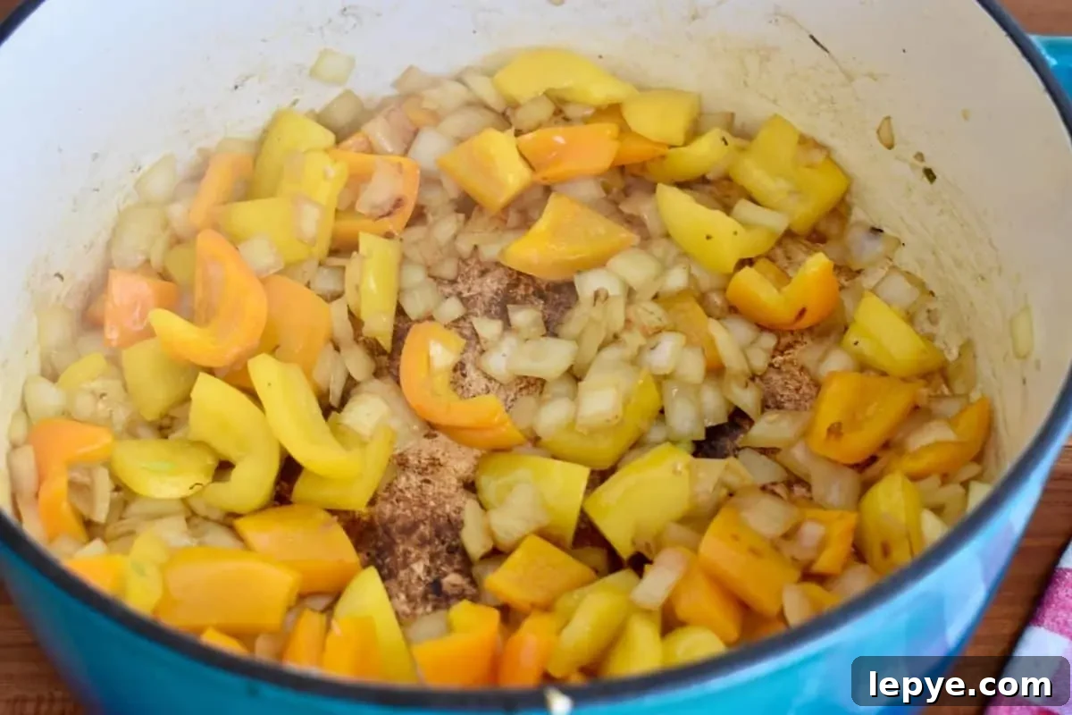 Stovetop Pan-Roasted Vegetables with Garlic White Beans 6 Cooked bell peppers and onions in a large pot.